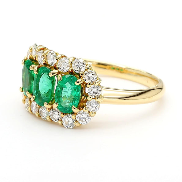 1.22 Carat Emerald & Diamond 18K Gold Halo Three Stone Band Ring