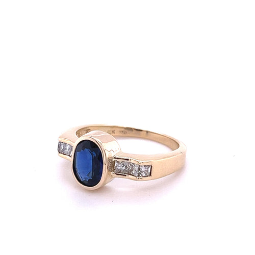 1.48 Carat Oval Cut Blue Sapphire With Princess Cut Diamond Ring in 18k Gold