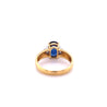 2.32 Carat Oval Cut Blue Sapphire with Trillion Cut Diamond Side stones in 18k Yellow Gold Ring