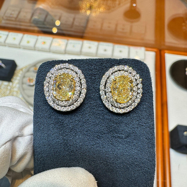 3.73 Carat TW Oval Cut Fancy Yellow Diamond Double Halo Stud Earrings