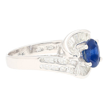 Natural 1.14 Carat Oval Cut Blue Sapphire with Round & Baguette Cut Diamonds in a Swirled 18K White Gold Ring Setting – Assay Jewelers