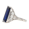 Vintage 8.56 carat Vivid Blue Sapphire and Trapezoid Diamond Ring in Platinum